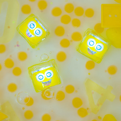 Jucarie senzoriala luminoasa Alex - Glo Cube, galben - Glo Pals